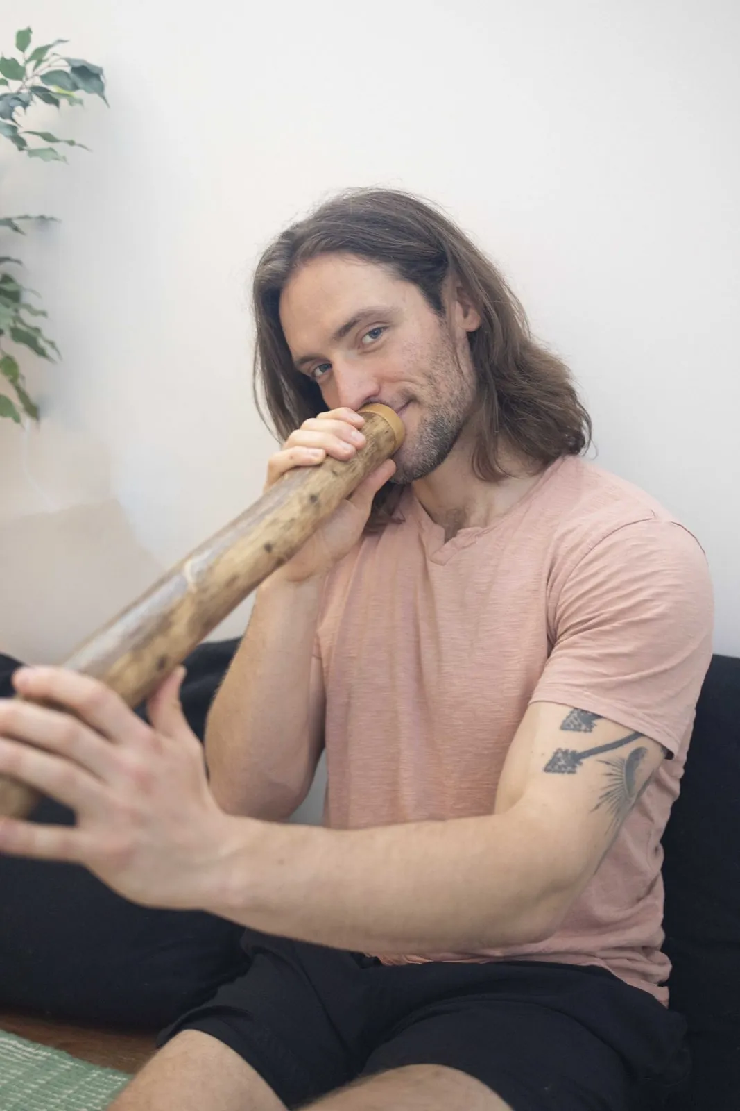 Evan playing the didgeridoo during a recovery session